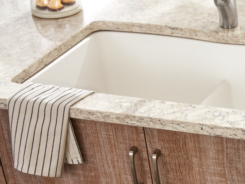 Porcelain sink installed in a white granite countertop Porcelain sink installed in a white granite countertop