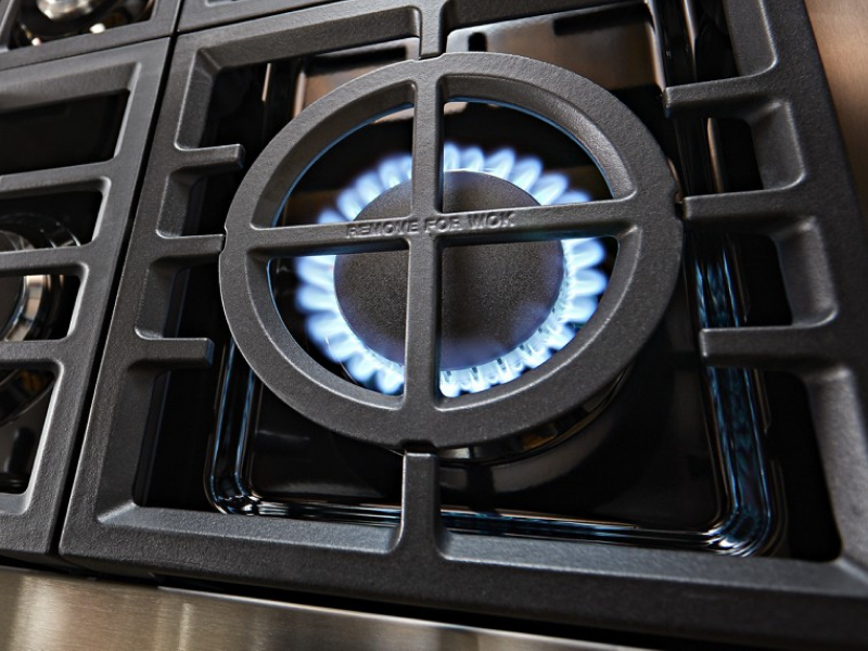 A gas stovetop with two activated burners