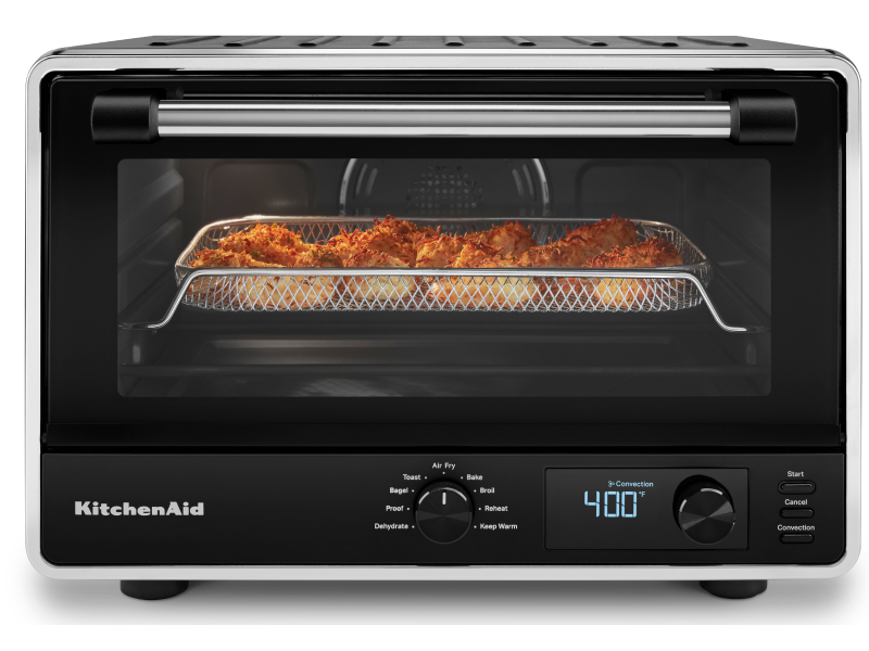 A KitchenAid® countertop oven with a basket of air fryer shrimp. A KitchenAid® countertop oven with a basket of air fryer shrimp.