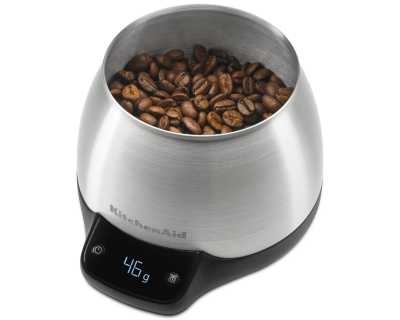 Fresh coffee beans in scale