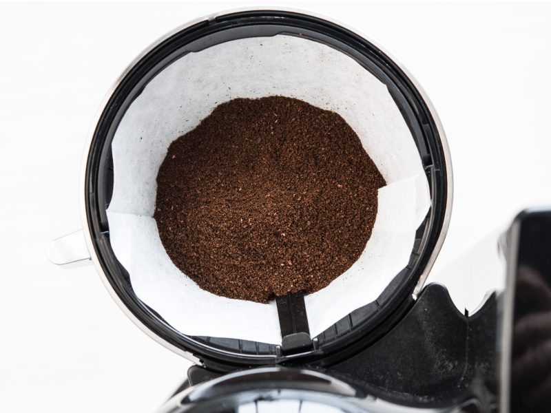 Fresh coffee beans in a coffee filter Fresh coffee beans in a coffee filter