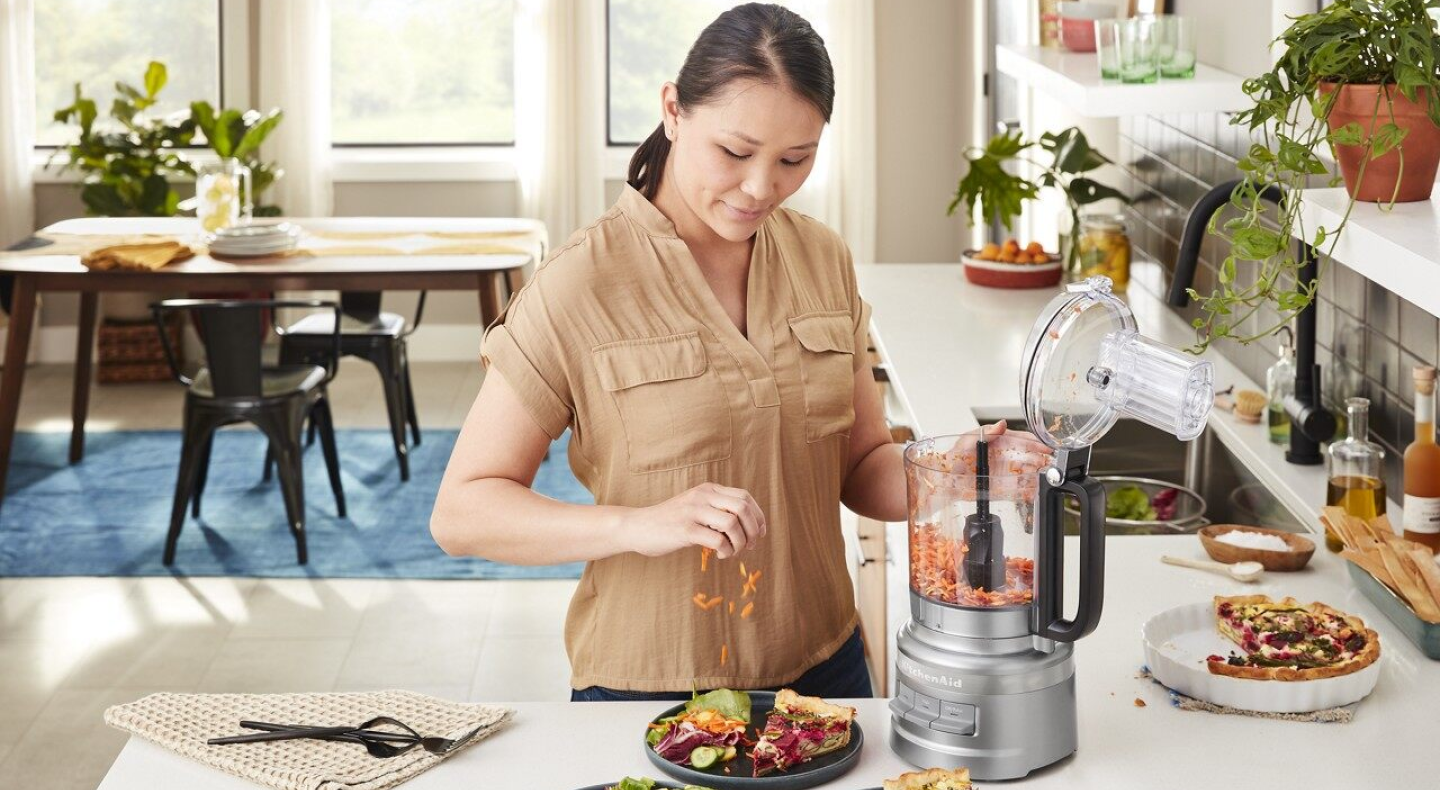 Person using KitchenAid® food processor Person using KitchenAid® food processor