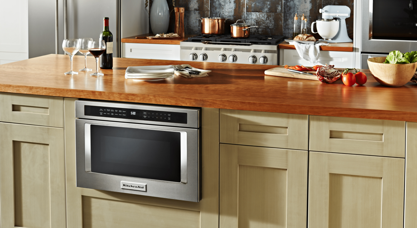 A stainless steel KitchenAid® built-in microwave in a modern kitchen A stainless steel KitchenAid® built-in microwave in a modern kitchen