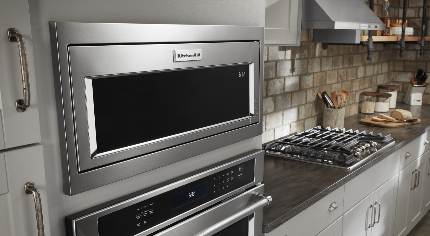 A KitchenAid® built-in microwave over a stainless steel wall oven A KitchenAid® built-in microwave over a stainless steel wall oven