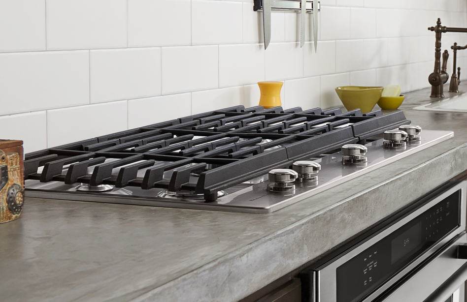 Gas cooktop on a cement countertop Gas cooktop on a cement countertop