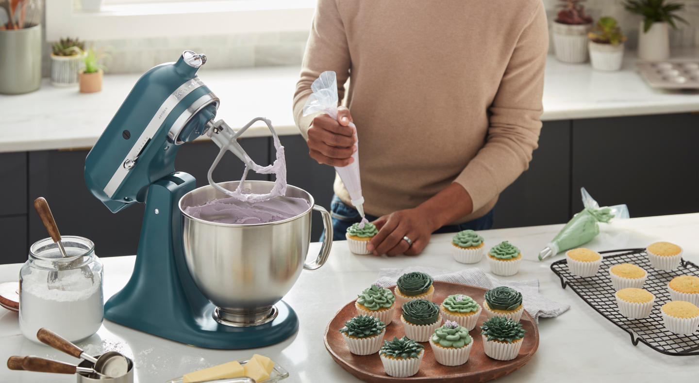 Person using a KitchenAid® stand mixer Person using a KitchenAid® stand mixer