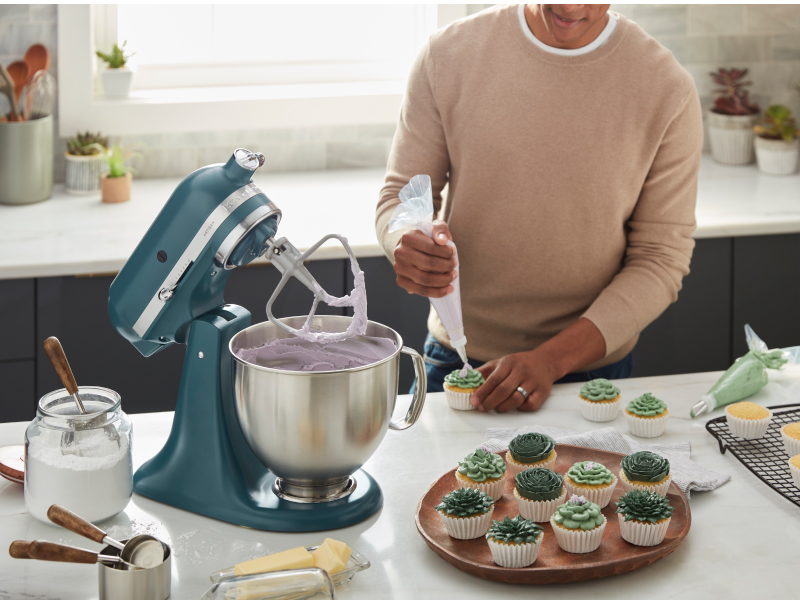 Person using a KitchenAid® stand mixer Person using a KitchenAid® stand mixer