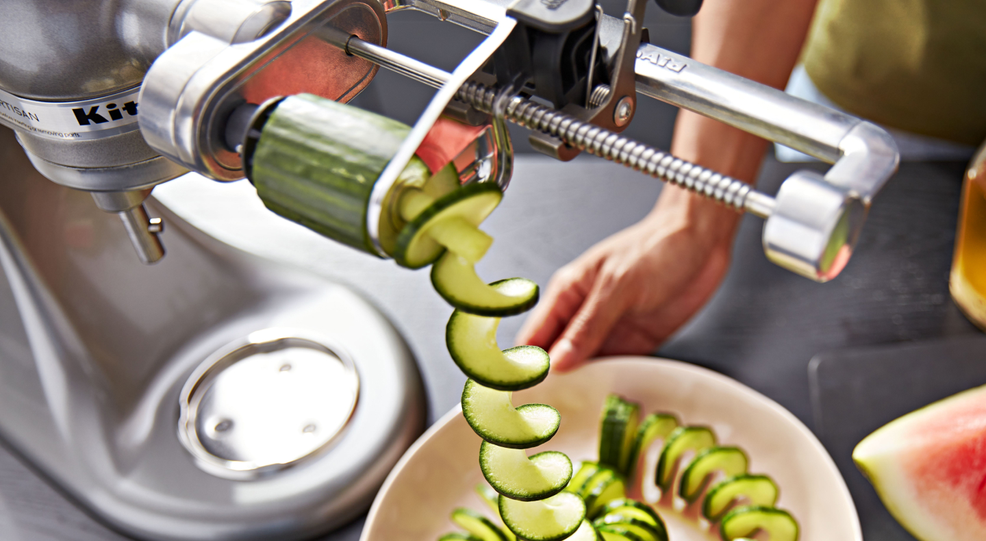 A KitchenAid® spiralizer with a cucumber A KitchenAid® spiralizer with a cucumber