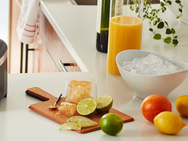 Ice and cut up fruit on a countertop