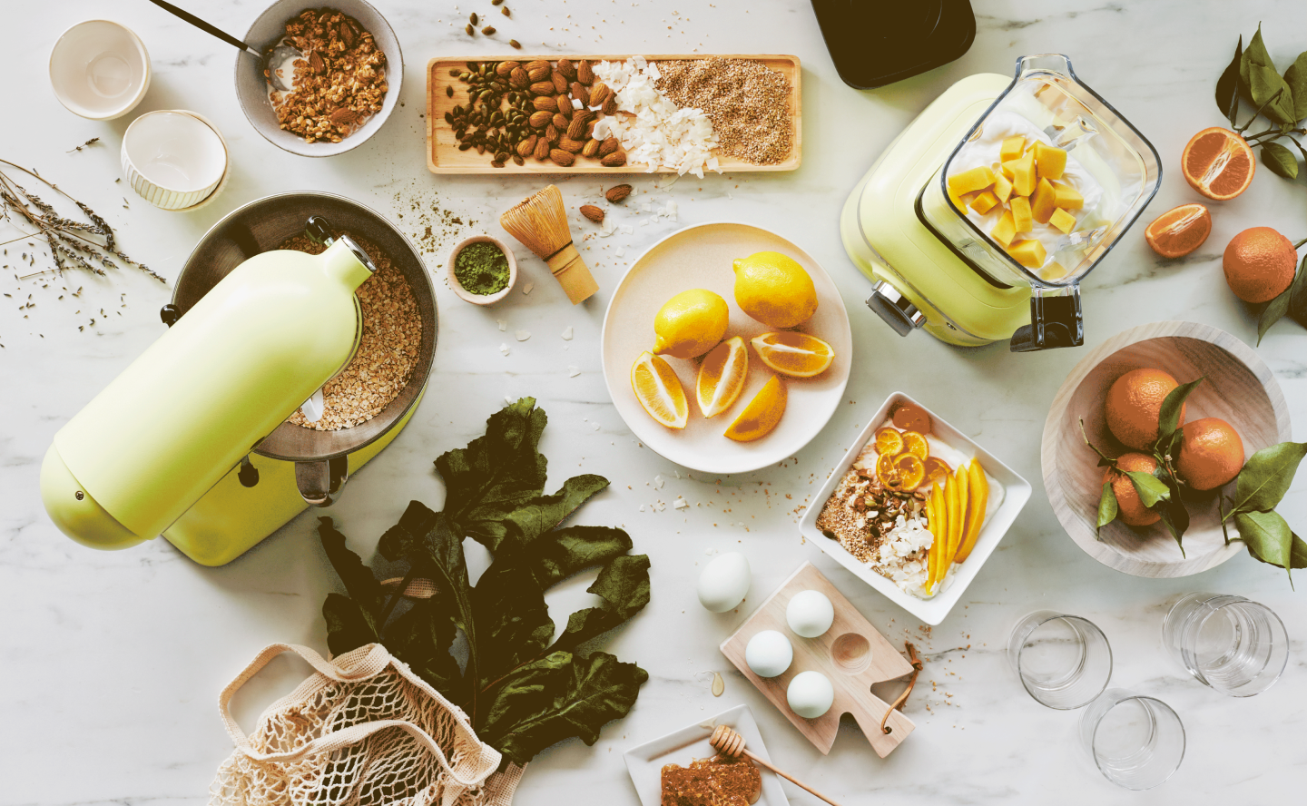 Various ingredients on a countertop next to a KItchenAid® stand mixer