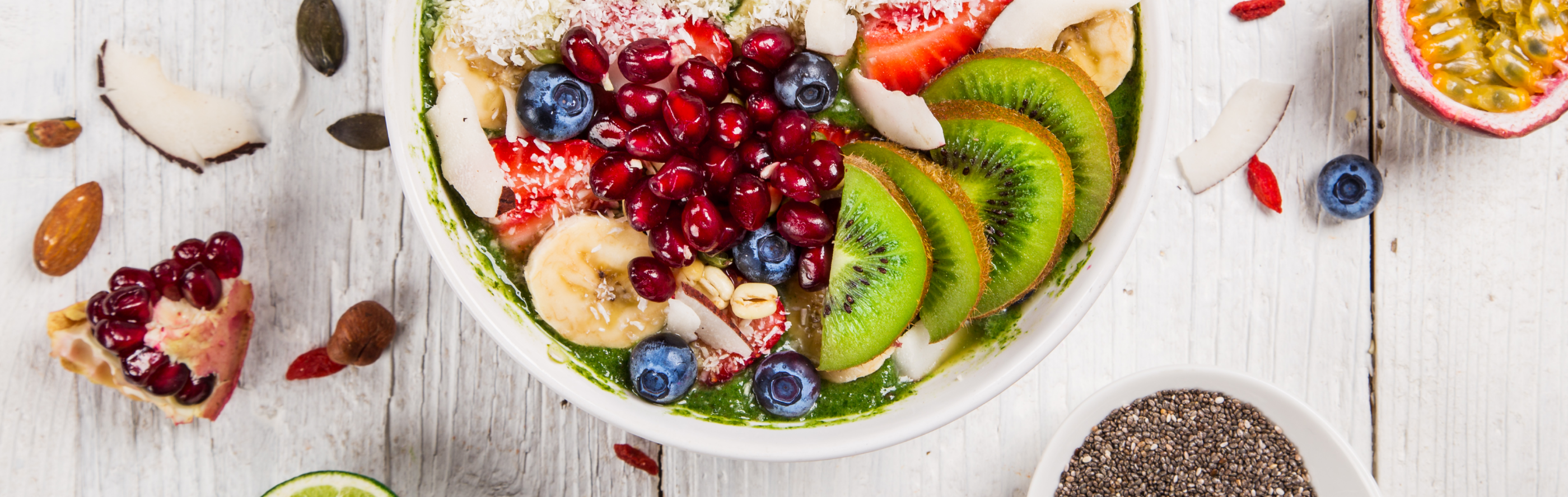 Smoothie bowl topped with a variety of fresh fruits
