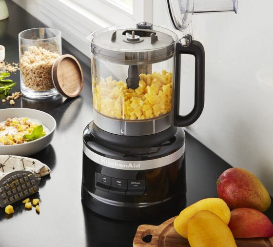 Diced mango in black KitchenAid® food processor for baby food snacks