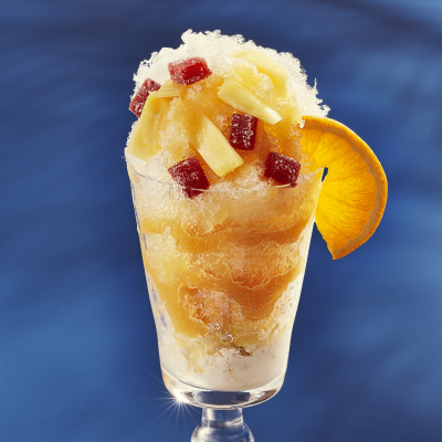 Shaved ice dessert with fruit syrup and various toppings