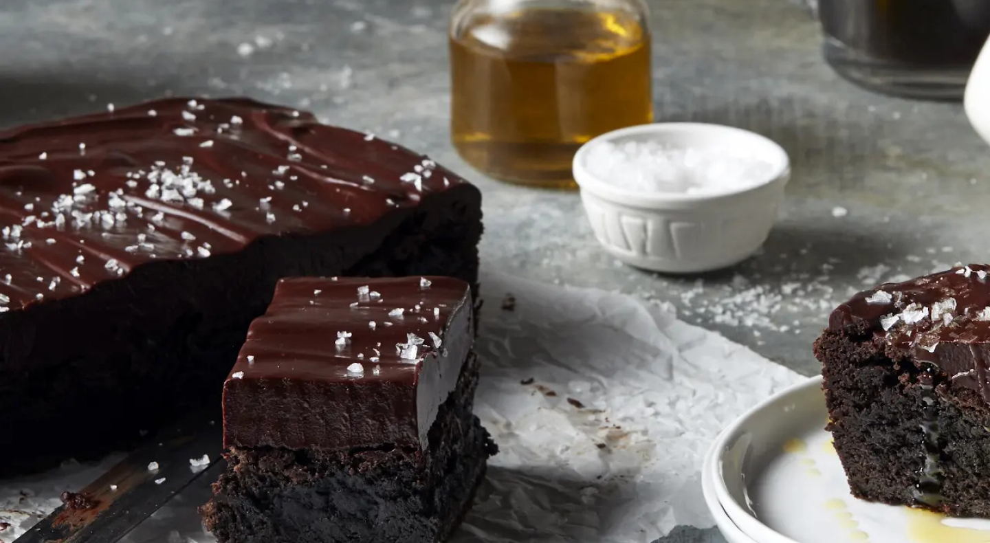 Chocolate frosted brownies topped with flaky sea salt Chocolate frosted brownies topped with flaky sea salt