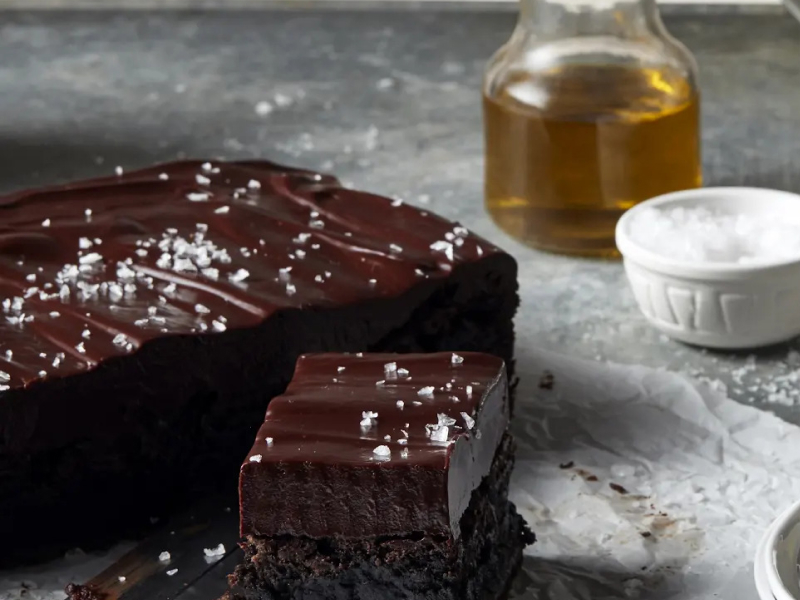 Chocolate frosted brownies topped with flaky sea salt Chocolate frosted brownies topped with flaky sea salt