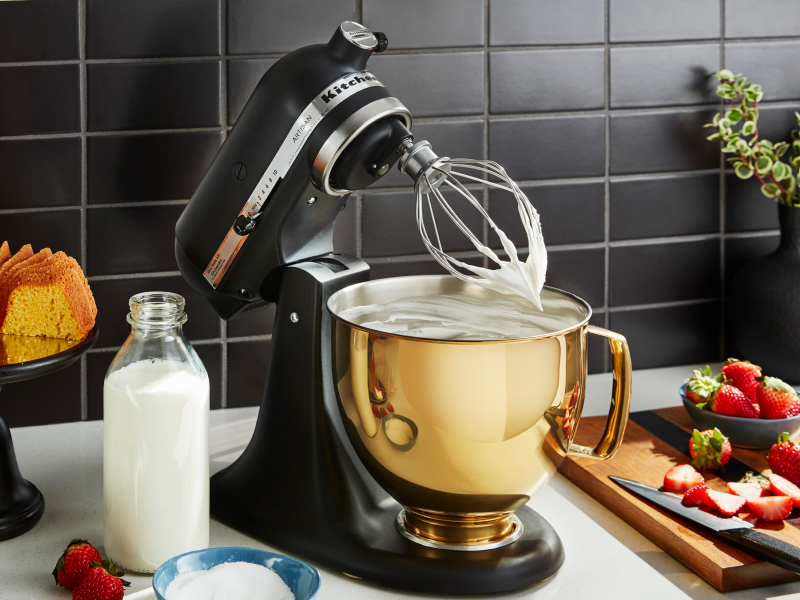 Stand mixer whisking something creamy Stand mixer whisking something creamy