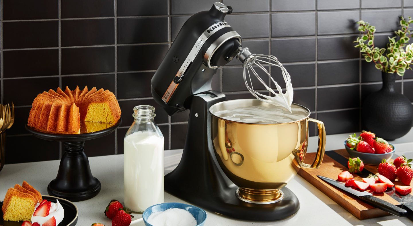 Stand mixer whisking something creamy Stand mixer whisking something creamy