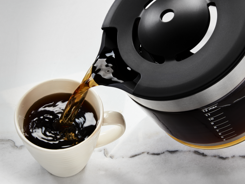 Coffee being poured into coffee cup