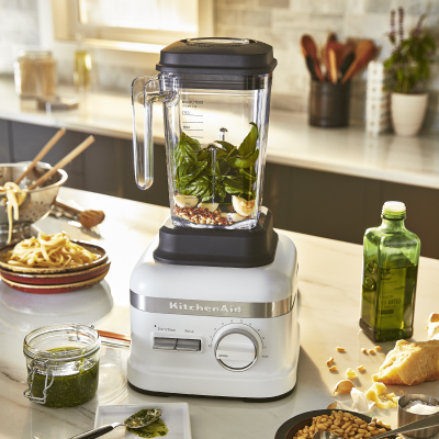 Chimichurri ingredients inside a KitchenAid® blender