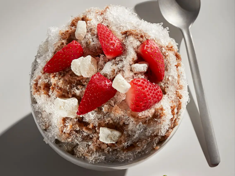 Shaved ice with strawberries on top Shaved ice with strawberries on top