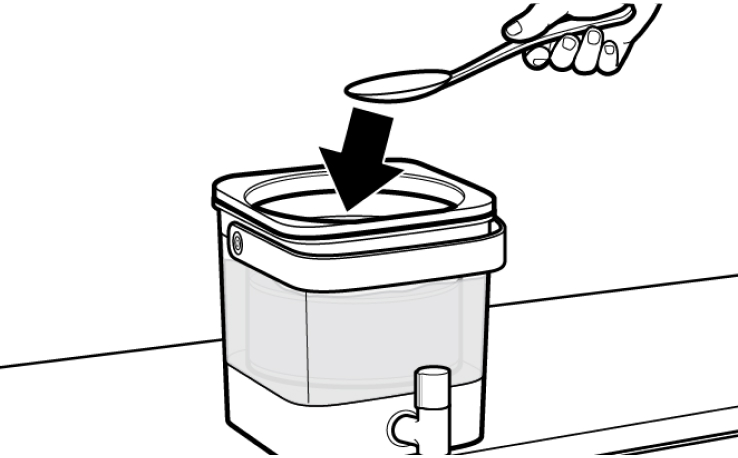 Hand using spoon to submerge cold brew coffee grounds in water