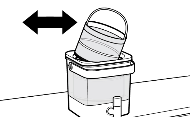 Cold brew coffee filter being removed from machine