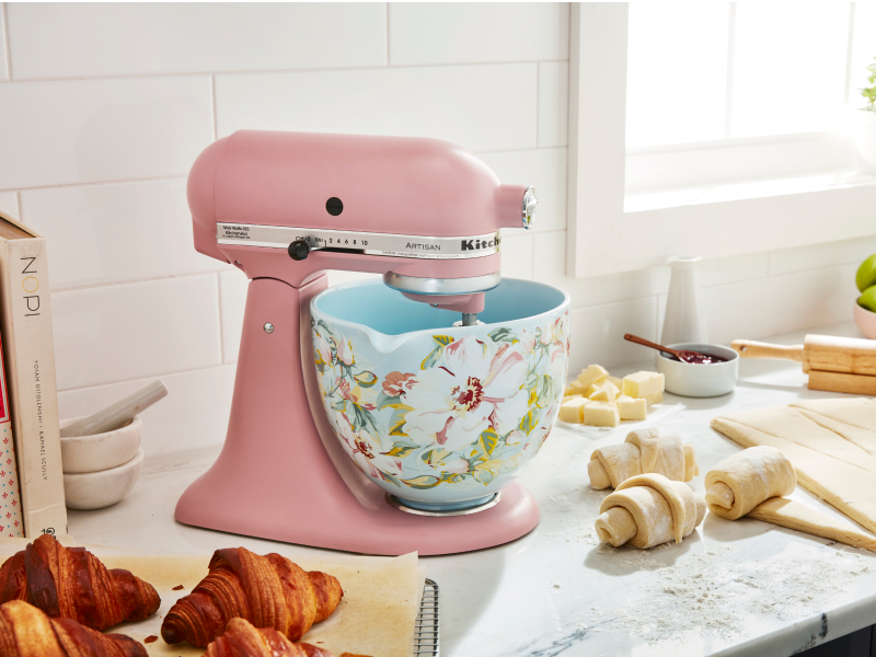Pink KitchenAid® stand mixer with patterned bowl next to croissant dough Pink KitchenAid® stand mixer with patterned bowl next to croissant dough