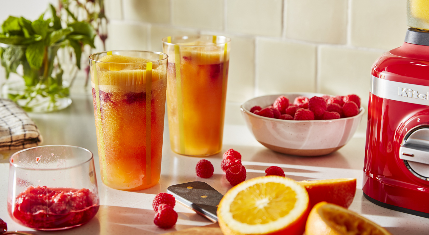 Frozen margaritas on a counter with fruit Frozen margaritas on a counter with fruit