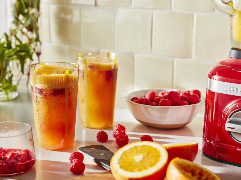 Frozen margaritas on a counter with fruit Frozen margaritas on a counter with fruit