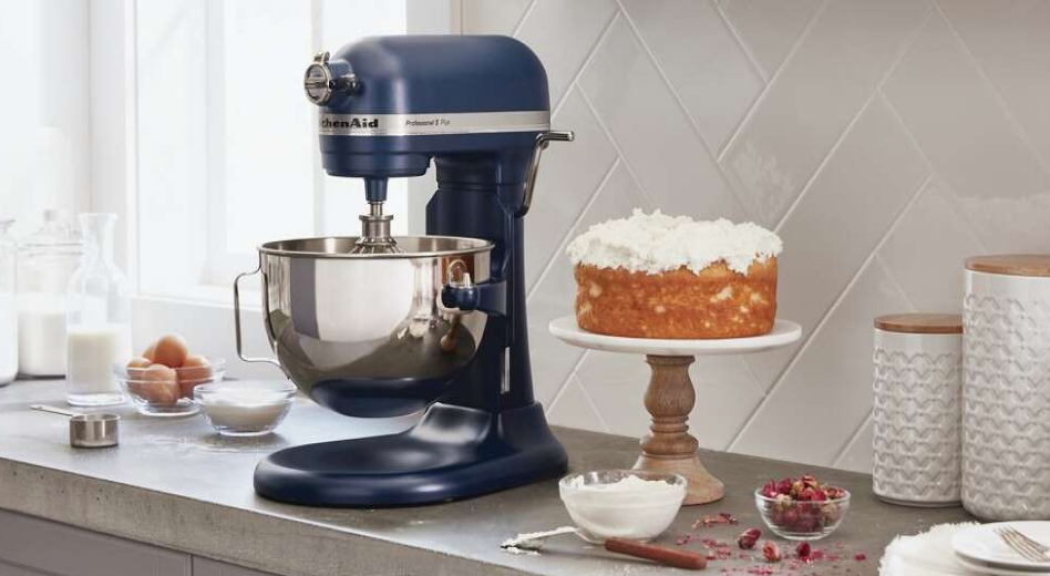 A KitchenAid® bowl-lift stand mixer next to a cake stand A KitchenAid® bowl-lift stand mixer next to a cake stand