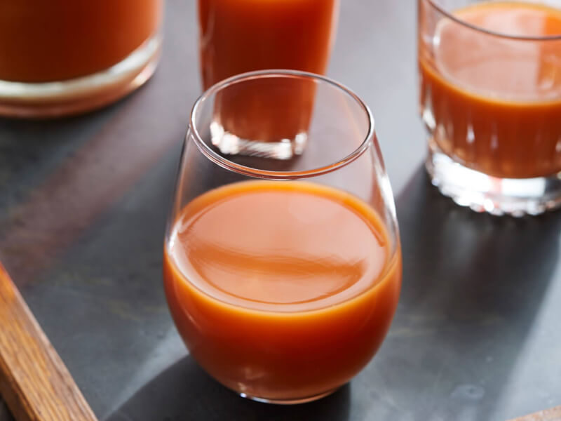 Orange and carrot juice in a stemless glass Orange and carrot juice in a stemless glass