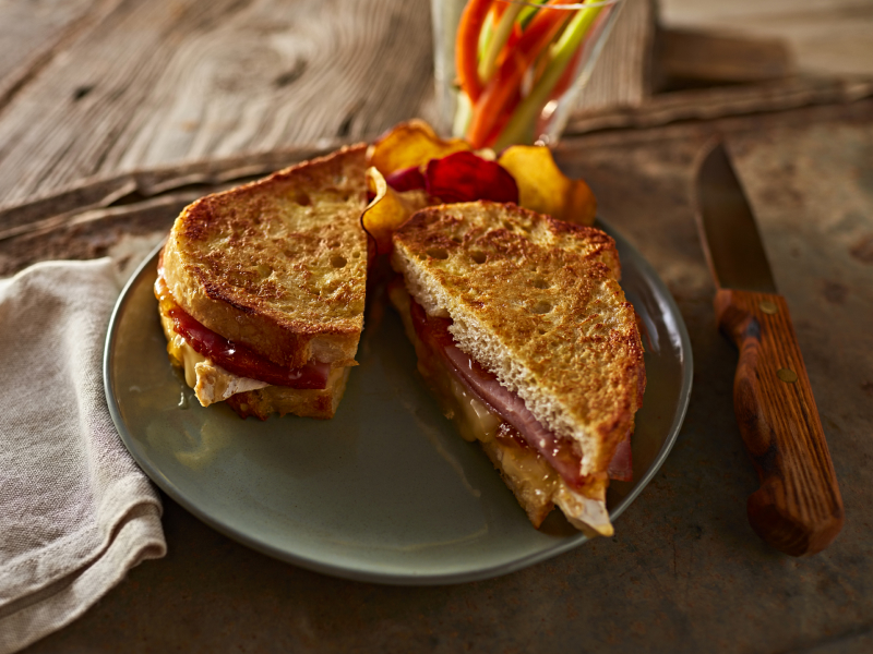 Syrupy ham French toast with fresh fruit on the side Syrupy ham French toast with fresh fruit on the side