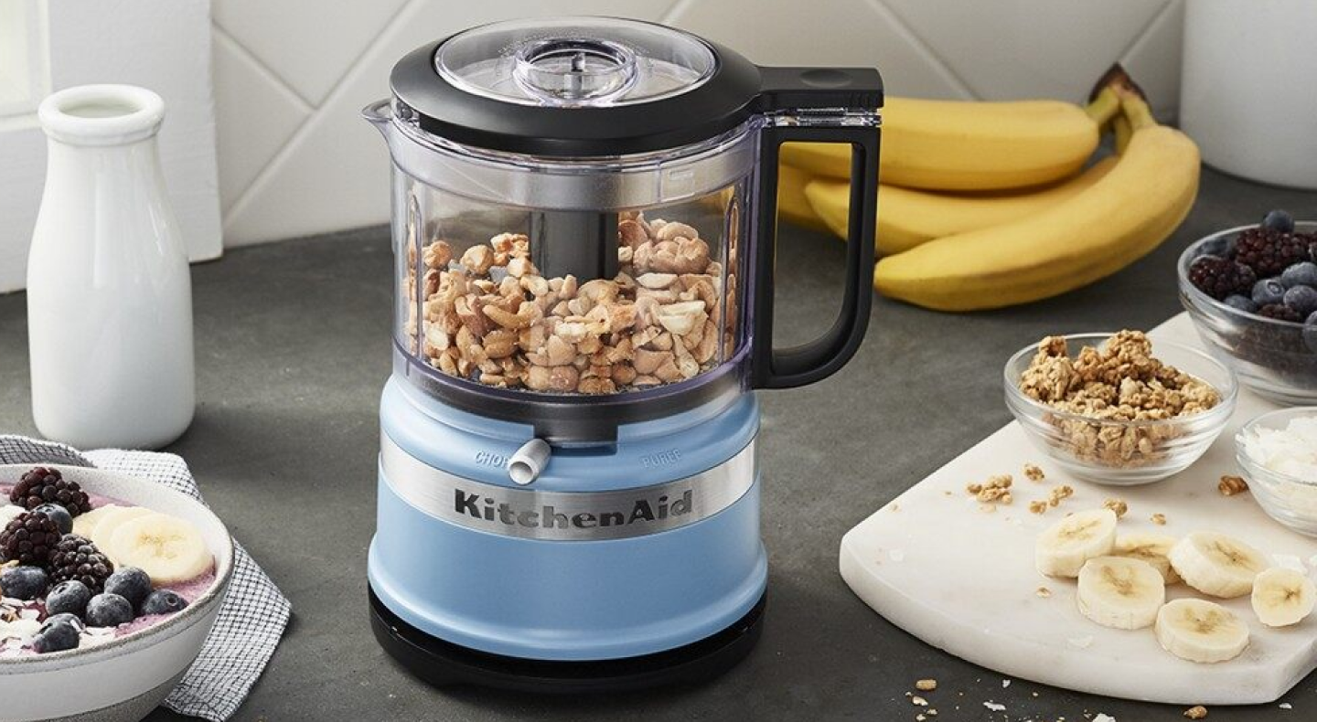 Peanuts inside a blue KitchenAid® food processor Peanuts inside a blue KitchenAid® food processor