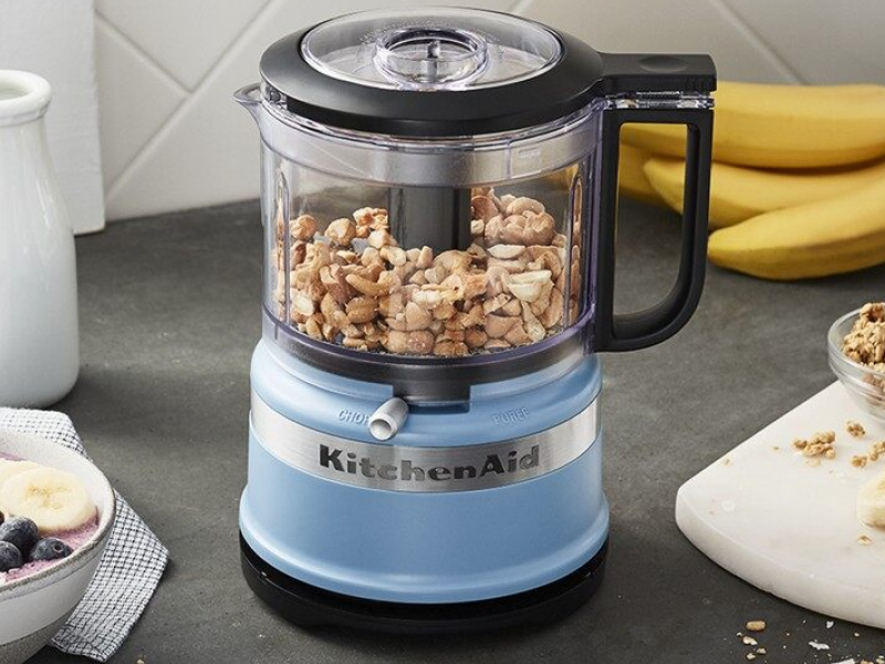 Peanuts inside a blue KitchenAid® food processor Peanuts inside a blue KitchenAid® food processor