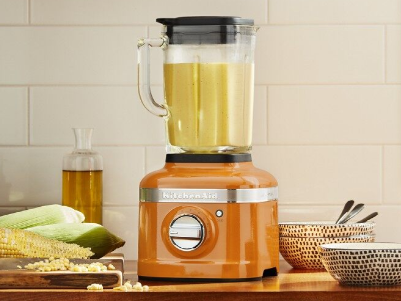 Food blending in an orange KitchenAid® blender Food blending in an orange KitchenAid® blender