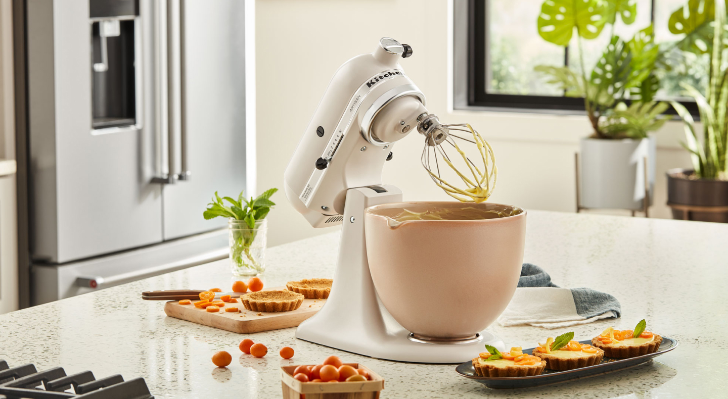 KitchenAid® stand mixer next to mini-quiches on countertop  KitchenAid® stand mixer next to mini-quiches on countertop