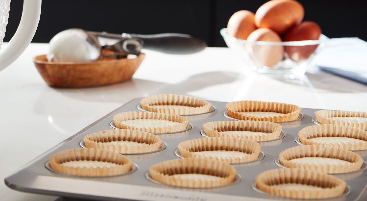Close up of mini quiches in baking tray Close up of mini quiches in baking tray