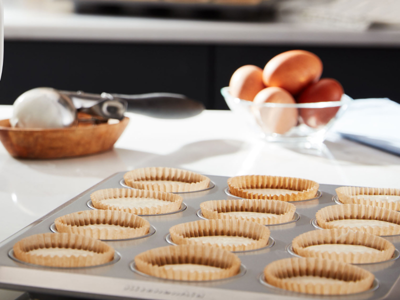 Close up of mini quiches in baking tray Close up of mini quiches in baking tray