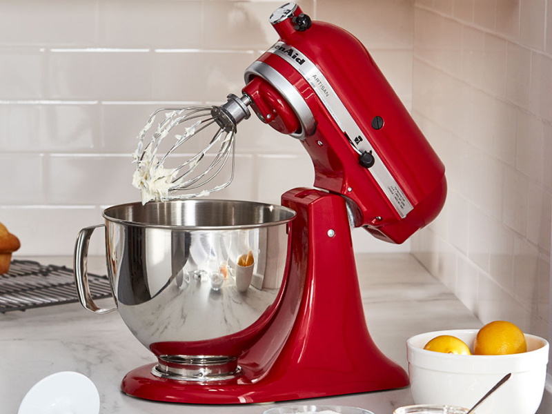 Red KitchenAid® stand mixer with stainless steel bowl and wire whisk attachment Red KitchenAid® stand mixer with stainless steel bowl and wire whisk attachment