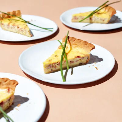 Three plates of deep dish ham quiche from Yummly recipe