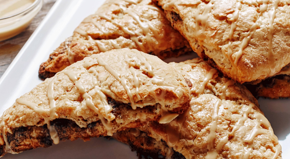 Homemade scones drizzled with glaze Homemade scones drizzled with glaze