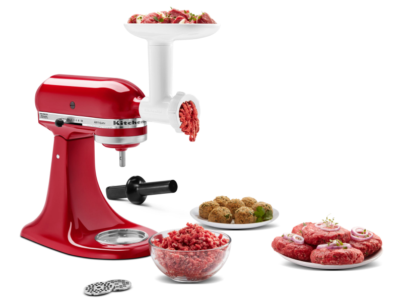 KitchenAid® stand mixer and meat grinder attachment grinding meat into bowl with plate of short rib patties and meatballs KitchenAid® stand mixer and meat grinder attachment grinding meat into bowl with plate of short rib patties and meatballs