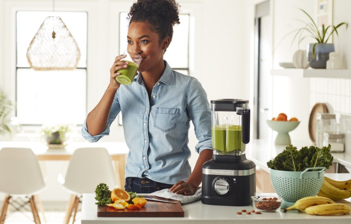 Person drinking a green smoothie