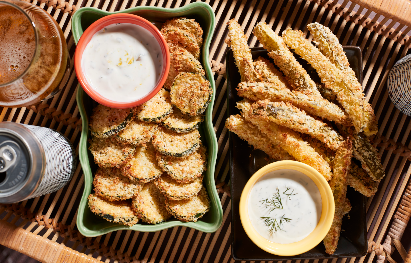 Plates of fried vegetables and dishes of vegan queso. Plates of fried vegetables and dishes of vegan queso.