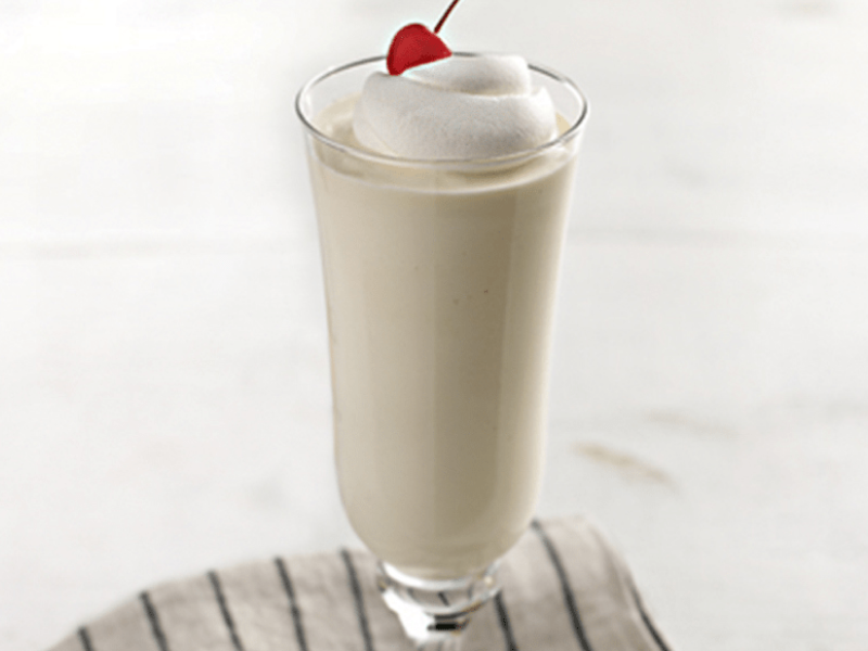 Milkshake with whipped cream and cherry on top Milkshake with whipped cream and cherry on top