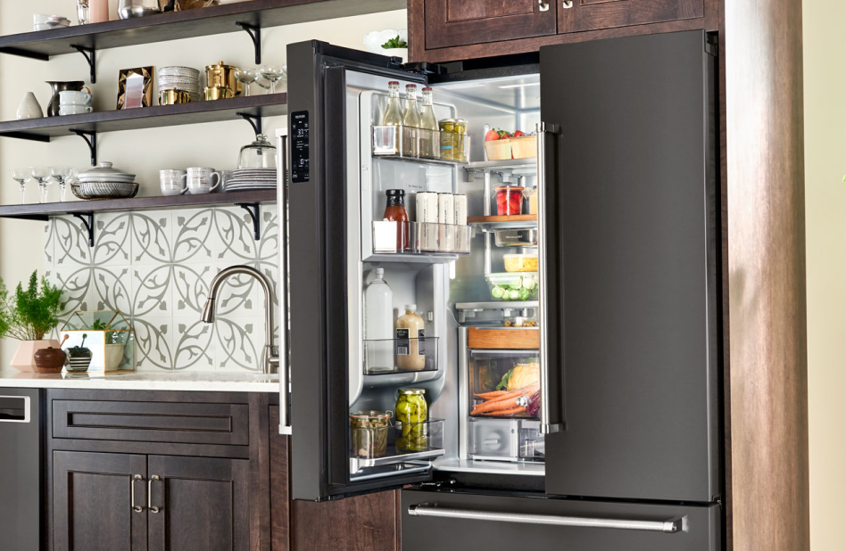 Condiments and bottled drinks stored in a refrigerator door. Condiments and bottled drinks stored in a refrigerator door.