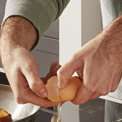 Person cracking an egg