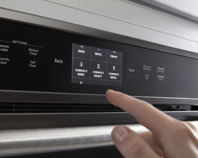 Hand making an oven selection