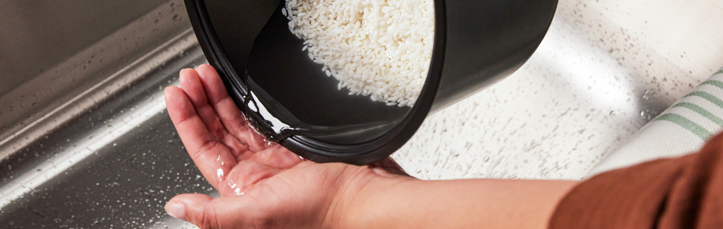 Person rinsing rice