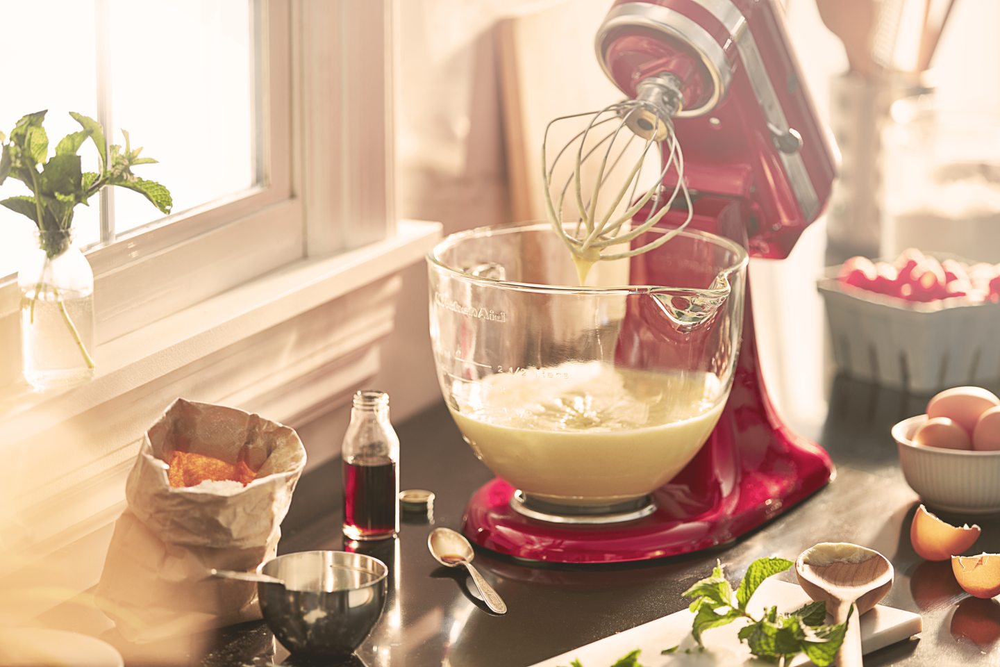 A stand mixer with a bowl of mix A stand mixer with a bowl of mix
